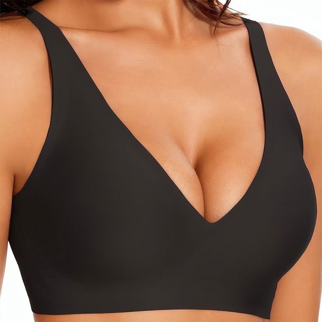 Black bra worn by a person on a white background