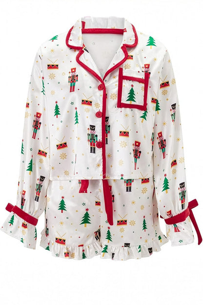 Christmas-themed pajama set with nutcrackers and trees on a white background