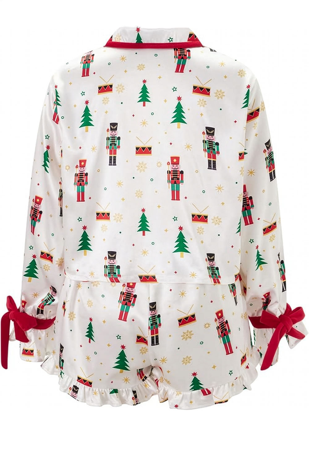 Christmas-themed baby romper with nutcrackers and trees on a white background