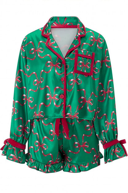 Green pajama set with red bows on a white background