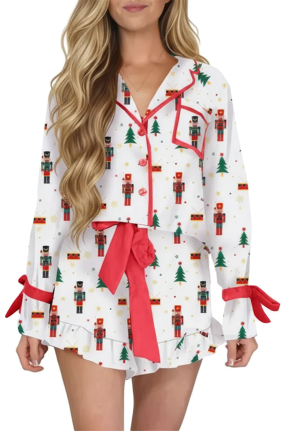 Woman wearing a Christmas-themed pajama set with nutcrackers and trees.