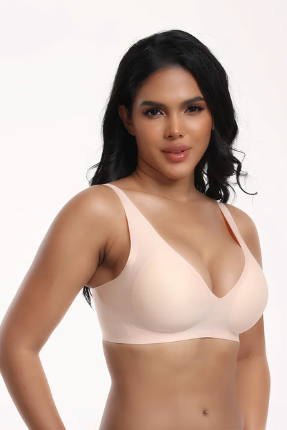 Woman wearing a beige bra on a white background