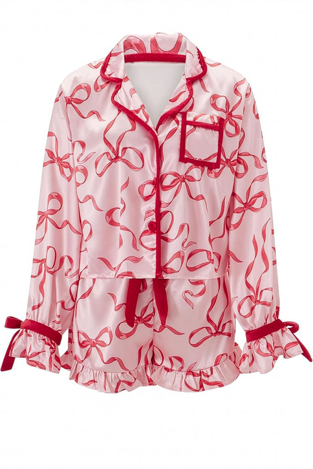 White pajama set with red bow pattern on a white background