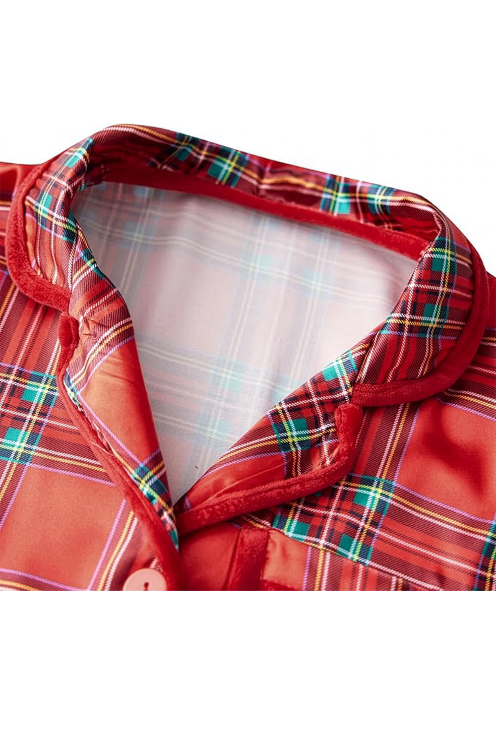 Close-up of a red plaid jacket with a white shirt underneath on a white background