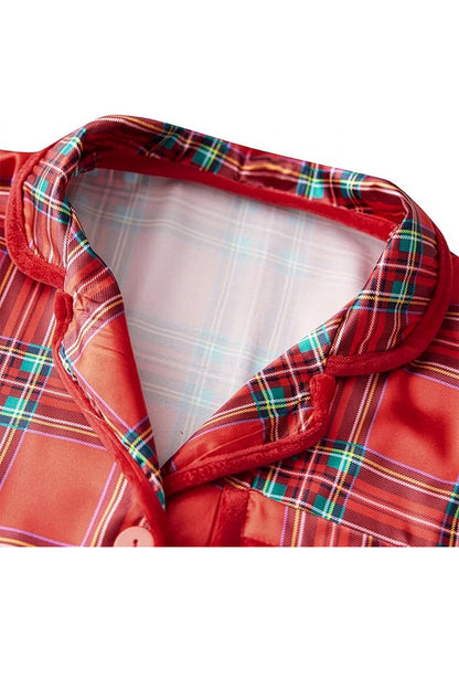 Close-up of a red plaid jacket with a white shirt underneath on a white background